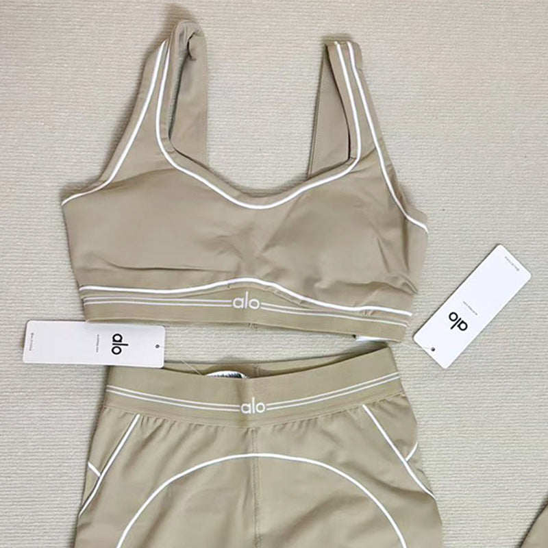 Women wearing high-quality a-l-o Yoga Set with supportive Airbrush Heart Throb Bra for yoga and pilates workouts