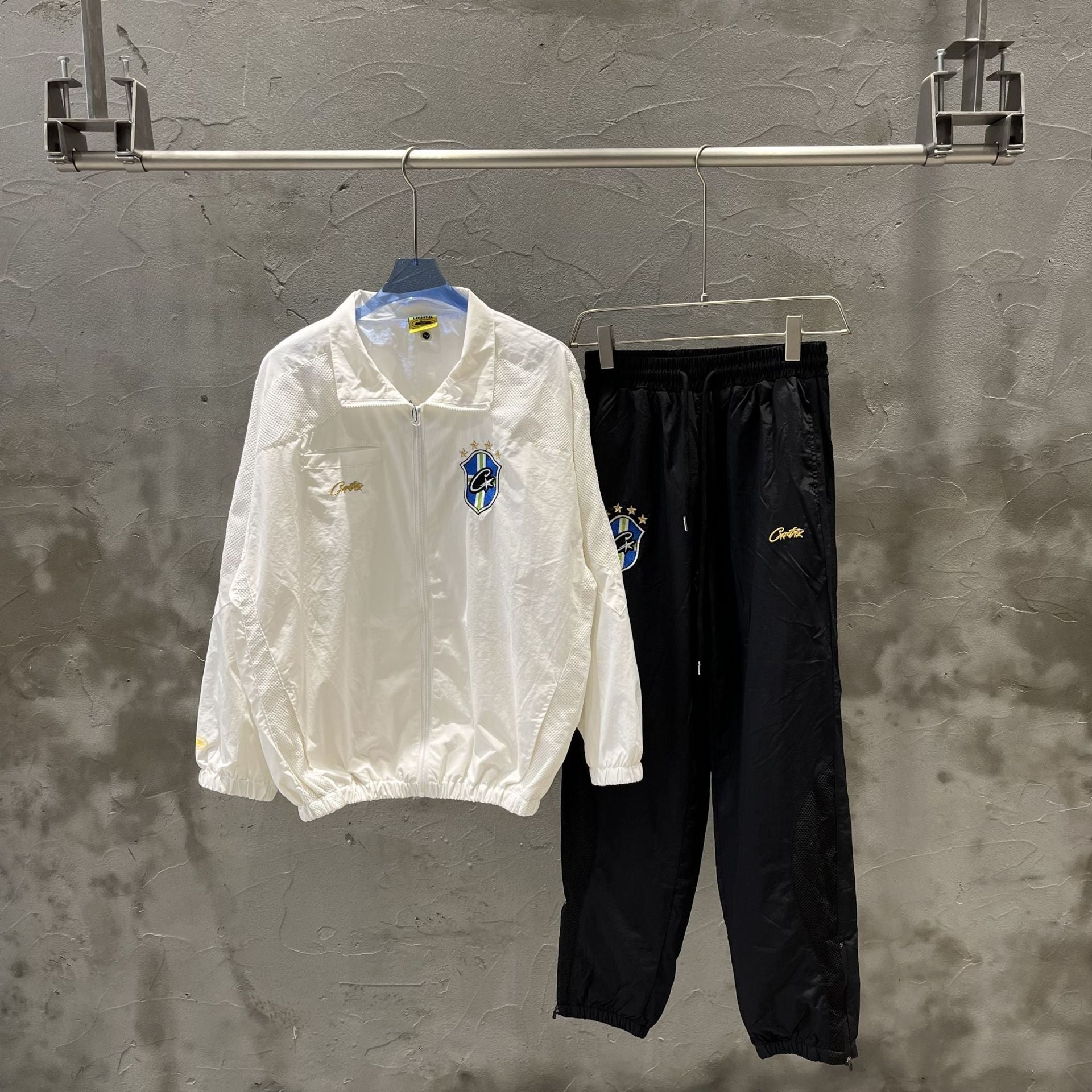 Men's New Corteiz Suit with embroidered logo, thin spring long pants, and zipper detail